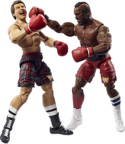 Creative Product ​WWE Elite Collection 2 Pack - Mr. T vs Rowdy Roddy Piper 6-in Action Figures with Boxing Robes and Swappable Hands, Posable Collectible Gift for WWE Fans Ages 8 Years Old and Up